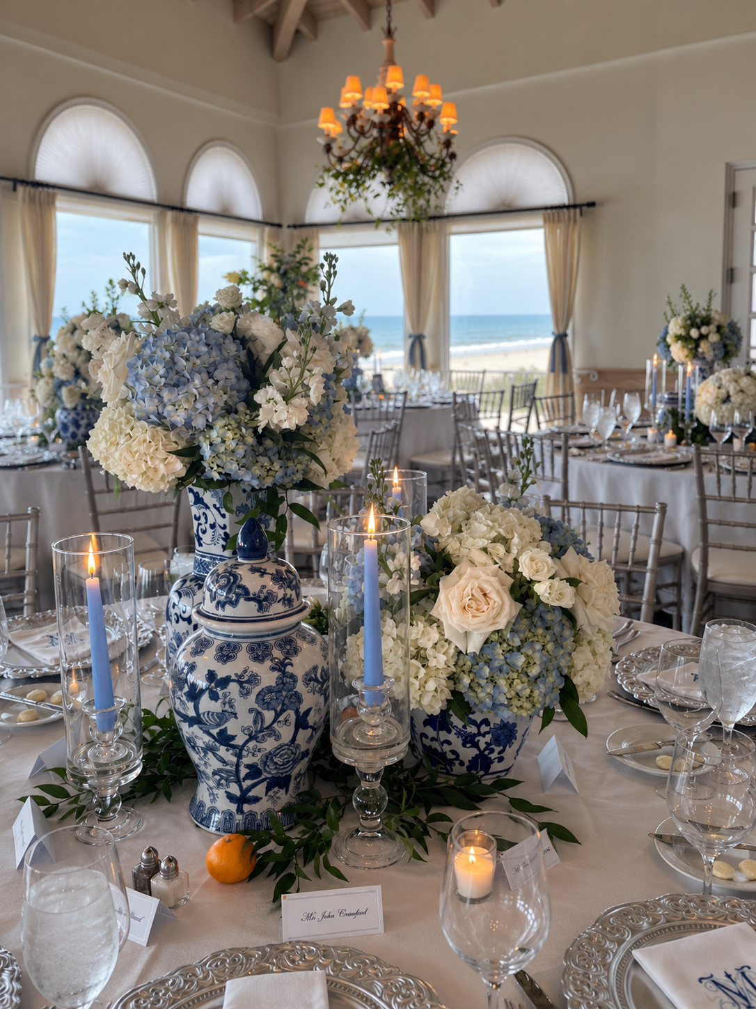 Blue and white wedding tablescape with floral details